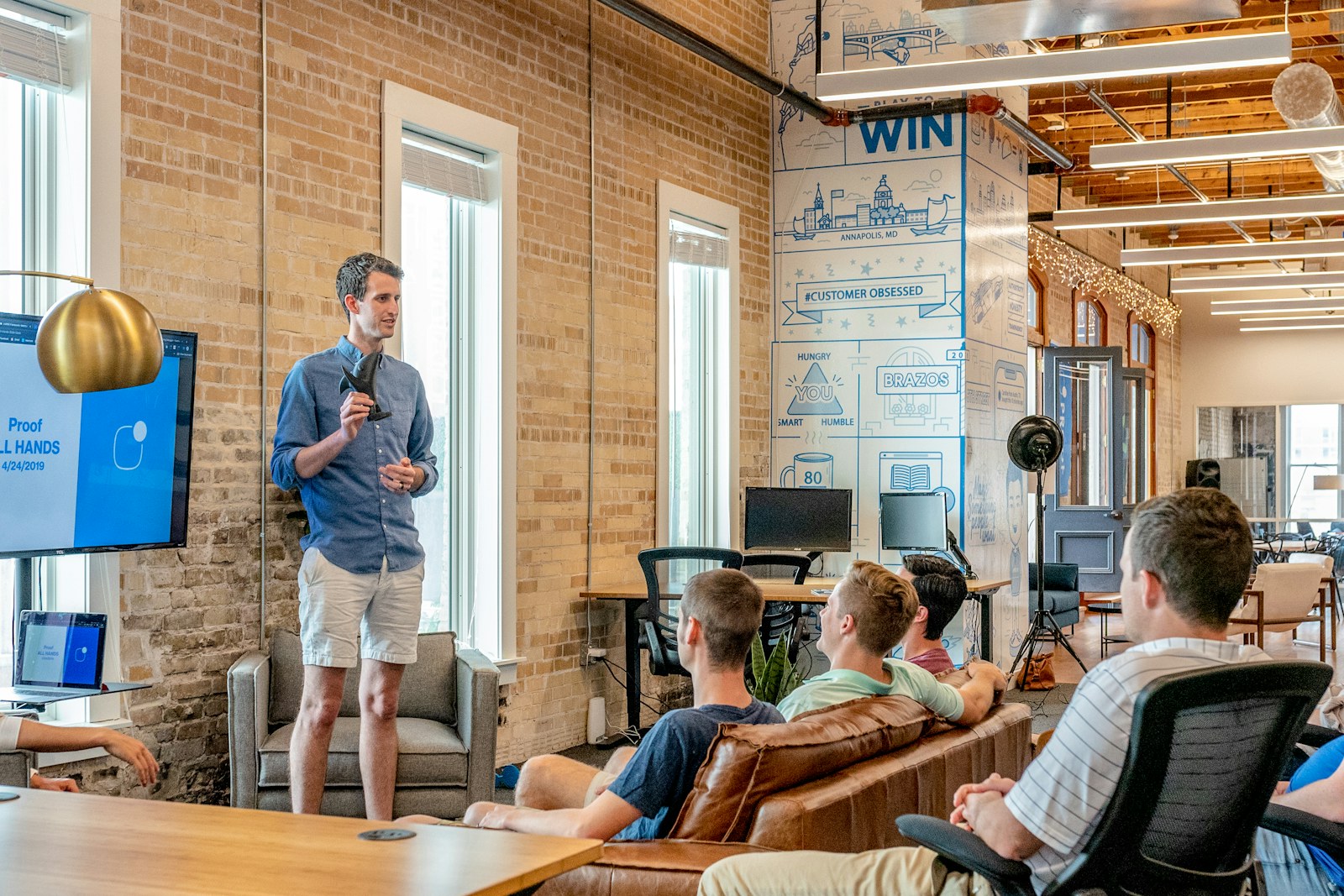 A team gathered for a discussion in an open office
